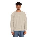 Man wearing a beige sweatshirt with an IKIRU logo on a white background