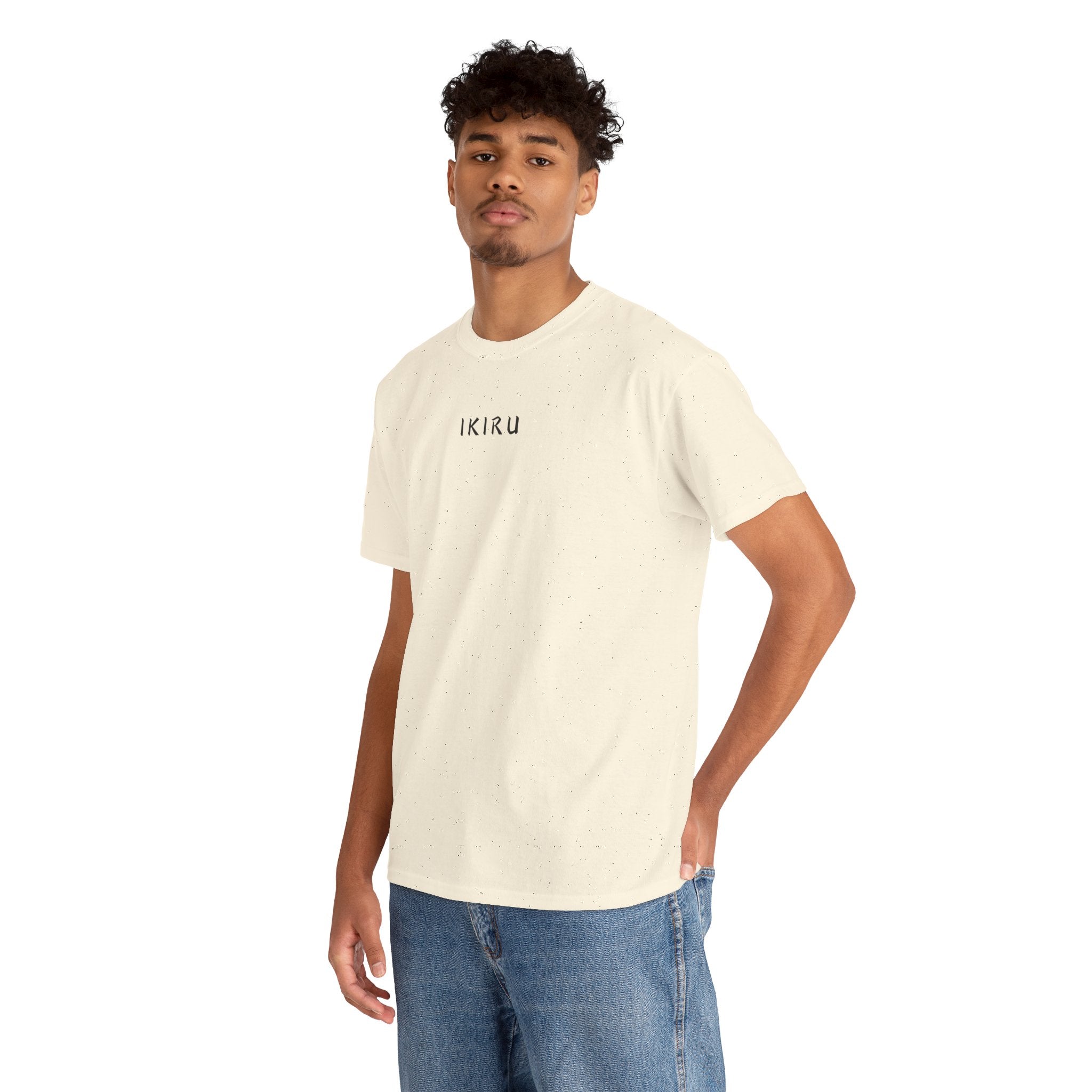 Man wearing a beige IKIRU t-shirt on a white background