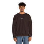 Man wearing a brown sweatshirt with IKIRU logo on a white background