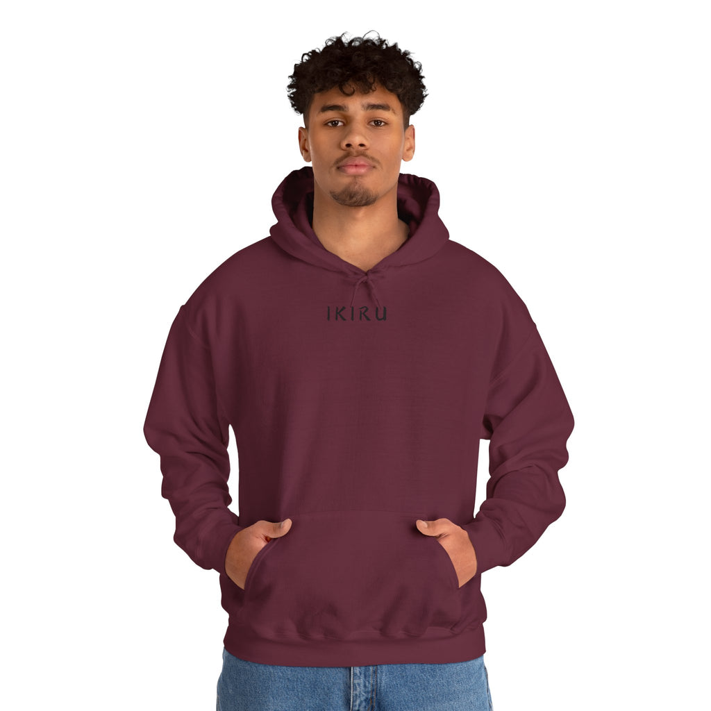 Maroon red hoodie with 'IKIRU' and mountain, samurai, and blossom tree design on the back saying 'un-influenceable' against a white background