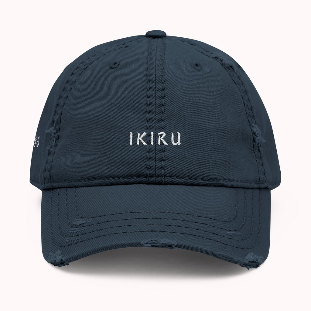 Navy blue cap with 'IKIRU' text on a white background