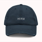 Navy blue cap with 'IKIRU' text on a white background