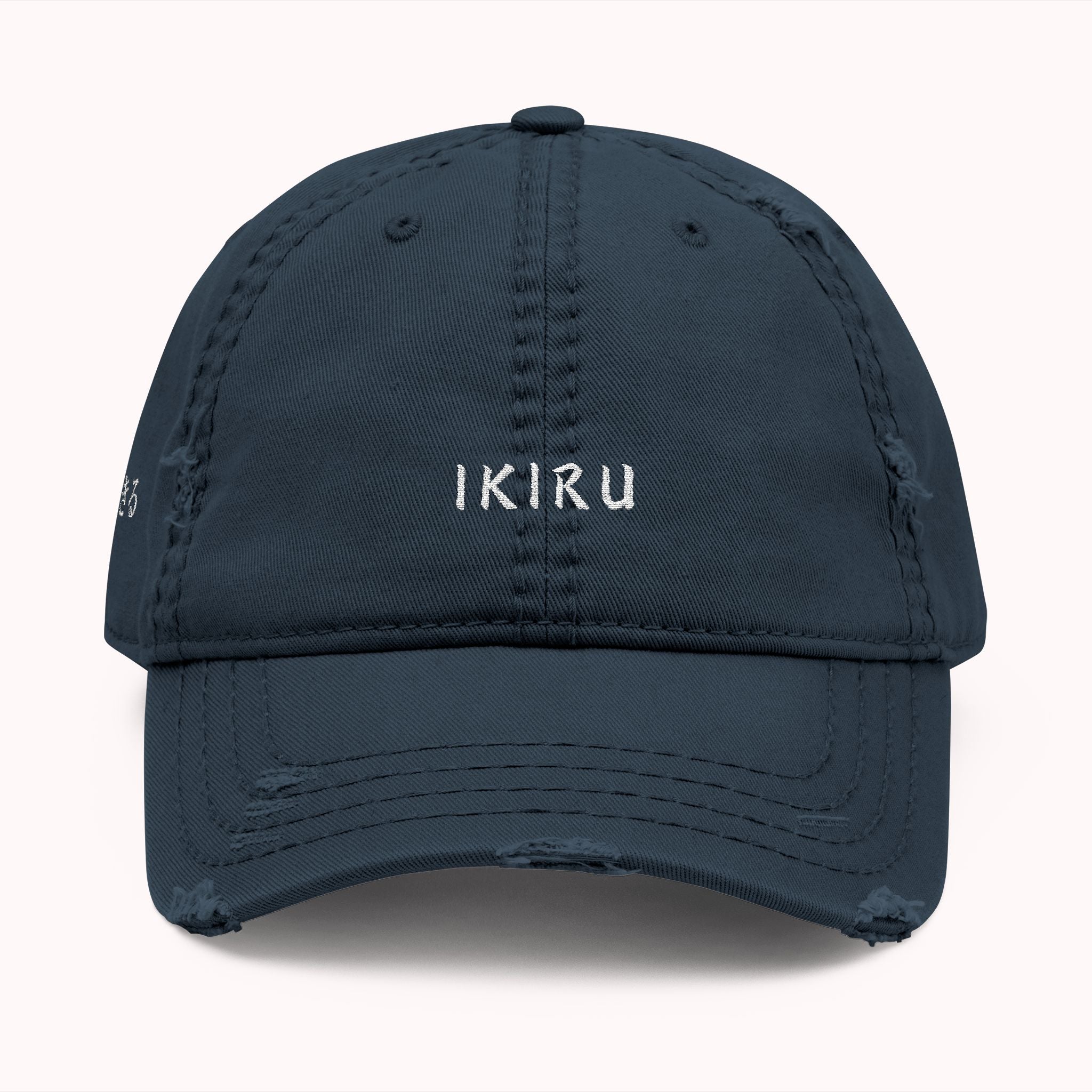 Navy blue cap with 'IKIRU' text on a white background