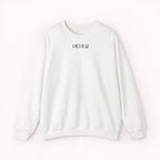 White sweater with a small ikiru logo on a white background
