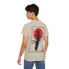 Man wearing a beige t-shirt with a graphic design on the back, standing against a white background