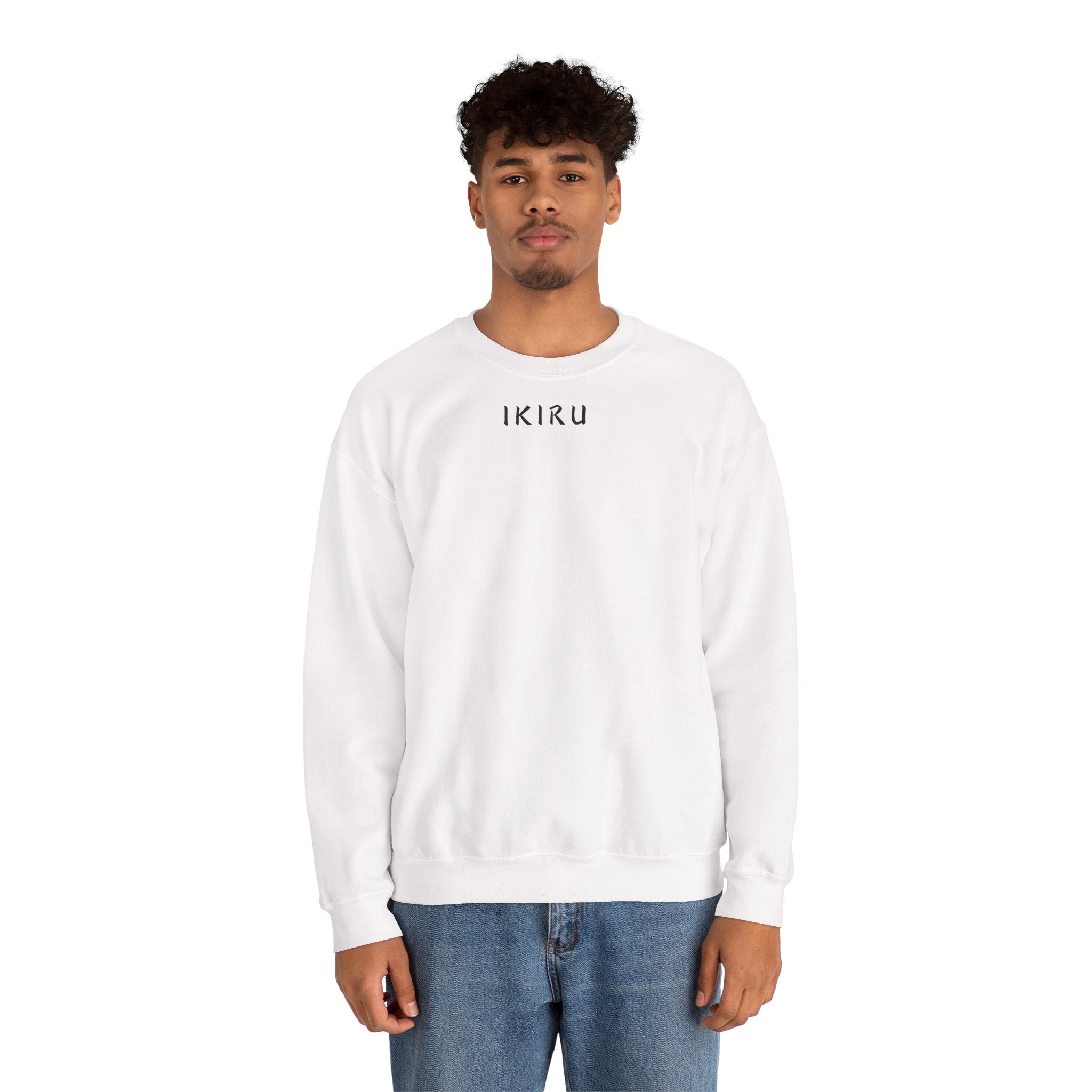Person wearing a white sweatshirt a small ikiru logo on a white background