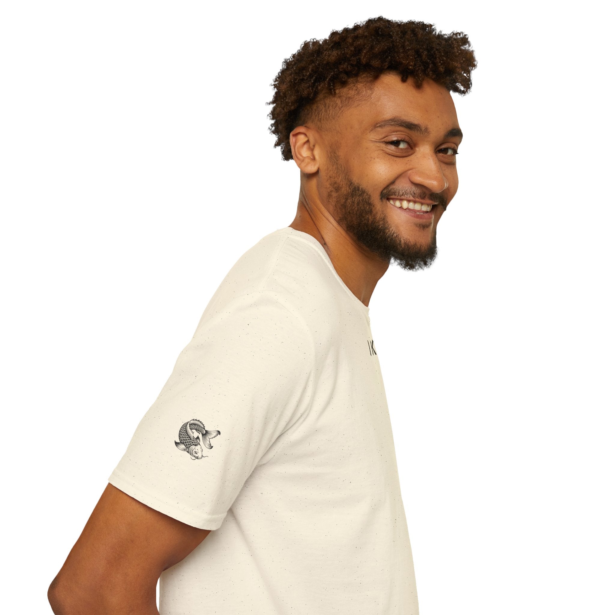 Man wearing a beige t-shirt with black text on a white background