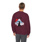 Man wearing maroon sweater with a mountain, samurai, and blossom tree design on the back saying 'un-influenceable' against a white background