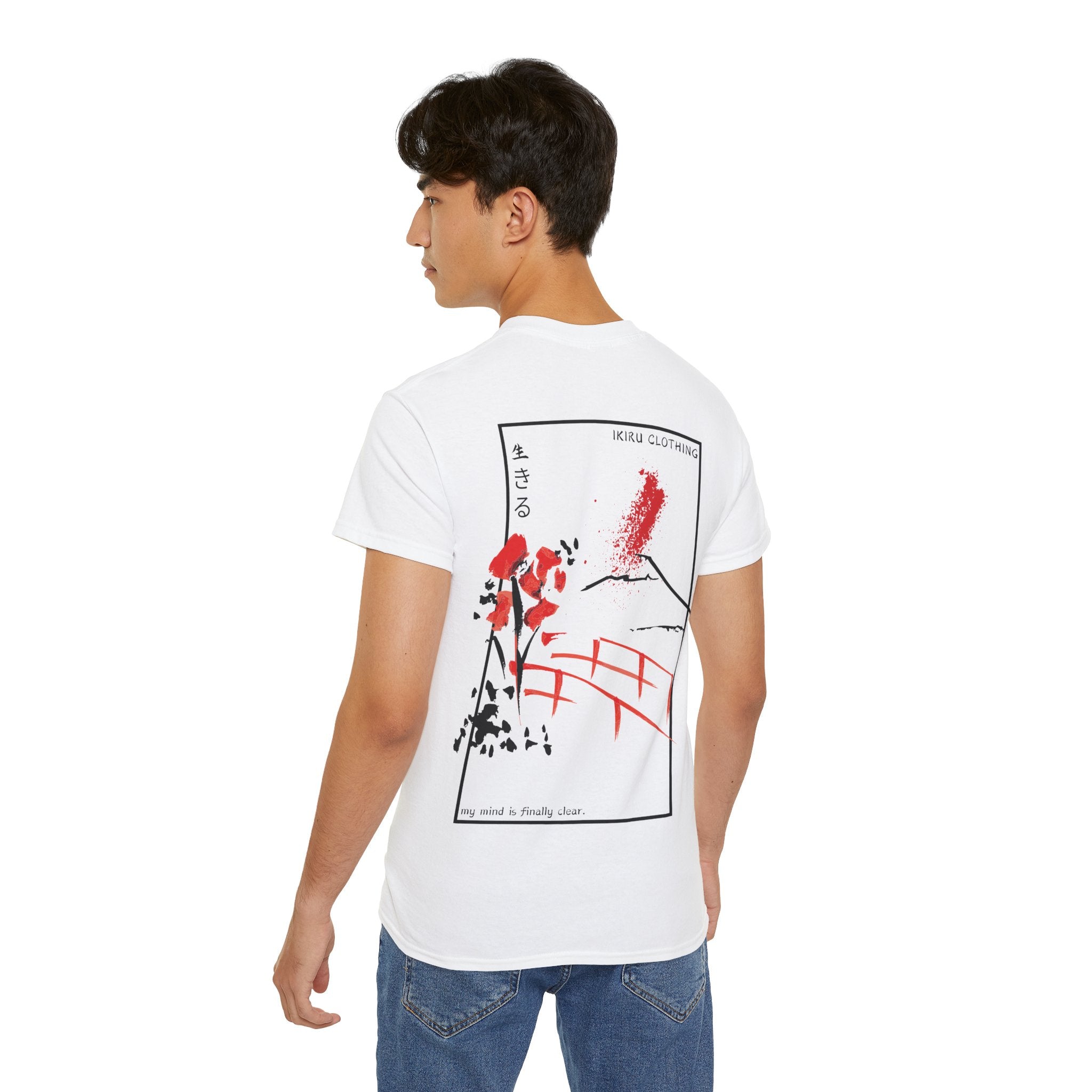 Person wearing a white t-shirt with a graphic design on the back, standing against a plain background.