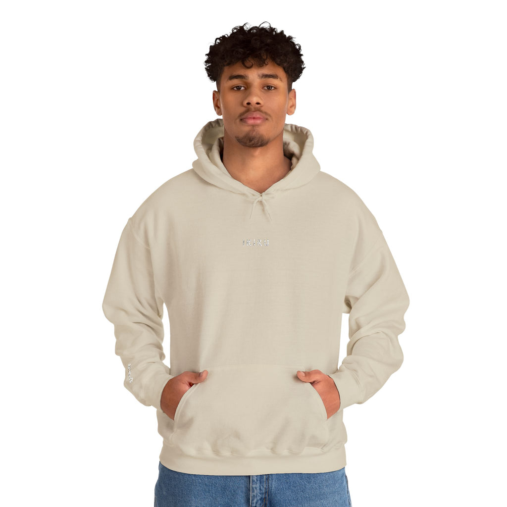 Person wearing a beige hoodie with IKIRU logo on a white background