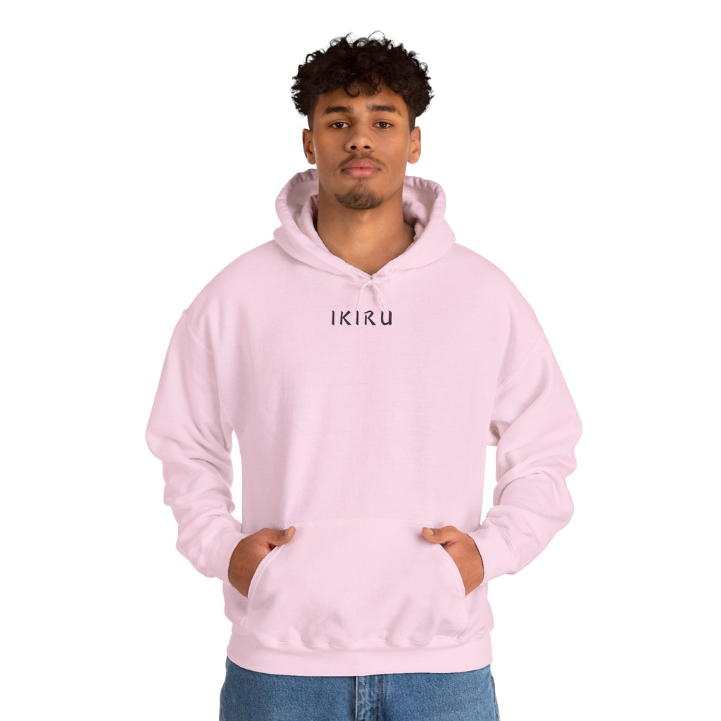 Light pink hoodie with 'IKIRU' and mountain, samurai, and blossom tree design on the back saying 'un-influenceable' against a white background