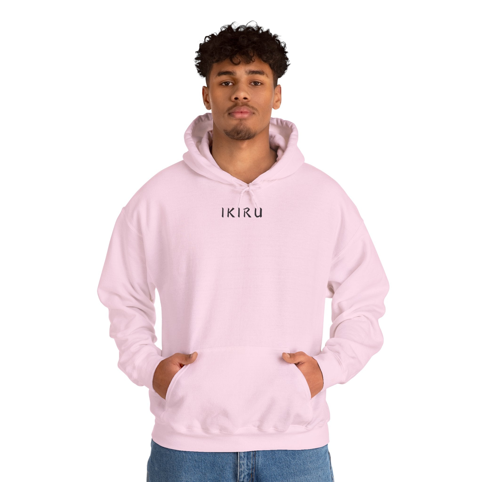 Light pink hoodie with 'IKIRU' and mountain, samurai, and blossom tree design on the back saying 'un-influenceable' against a white background