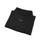 Folded black hoodie with 'IKIRU' text on a white background