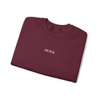 Folded Maroon sweatshirt with an IKIRU logo on a white background