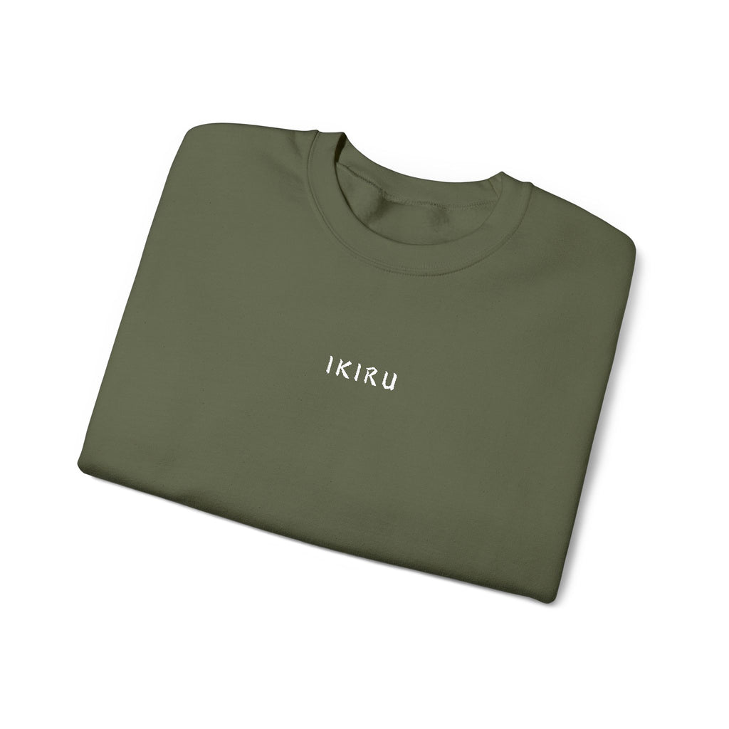 Folded Green sweatshirt with an IKIRU logo on a white background
