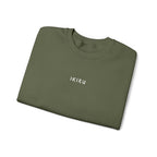 Folded Green sweatshirt with an IKIRU logo on a white background