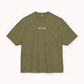 Green t-shirt with a small white logo on a white background