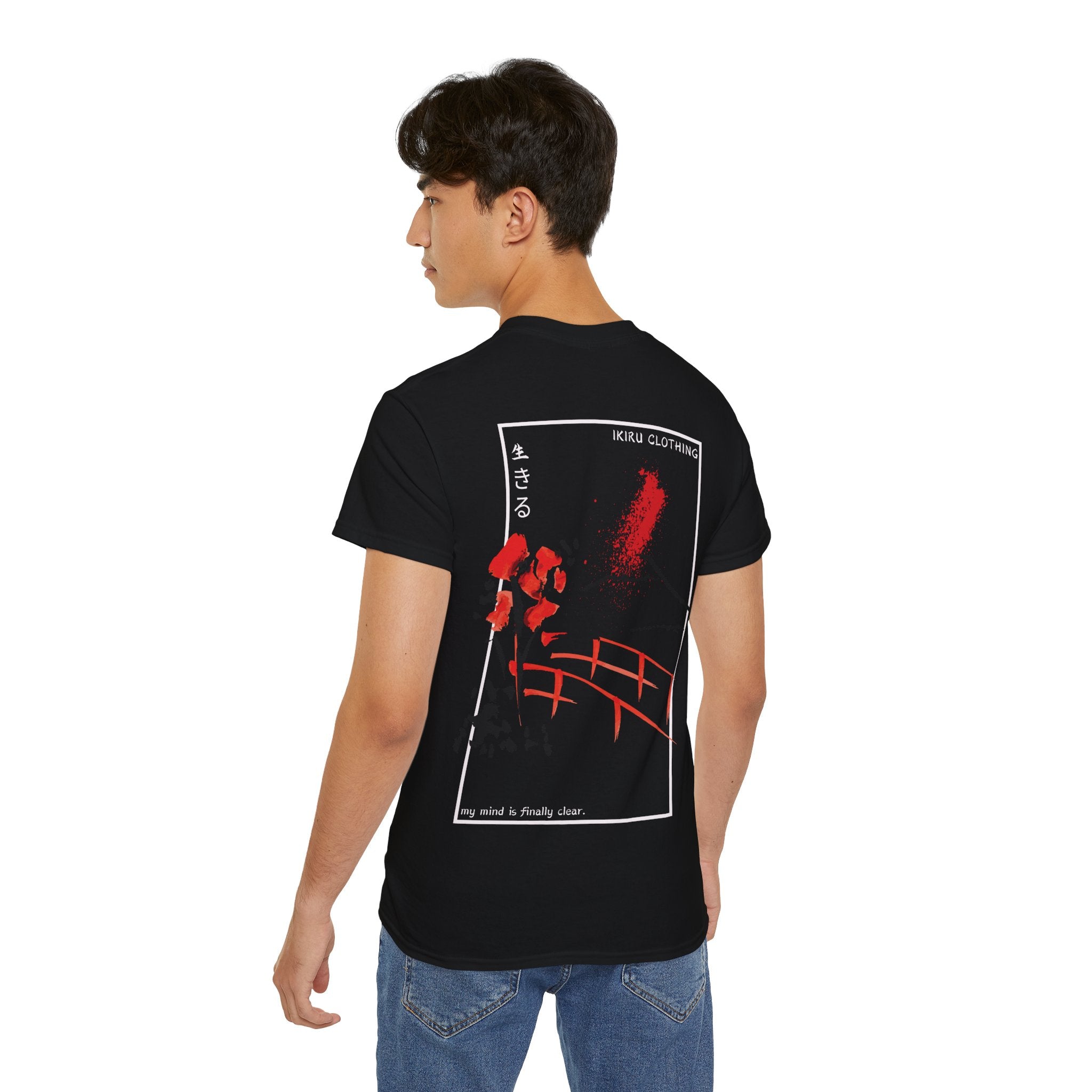 Person wearing a black t-shirt with red and white graphics on the back, standing against a white background.