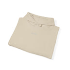 Folded beige hoodie with IKIRU logo on a white background