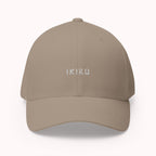Beige cap with IKIRU branding on a white background