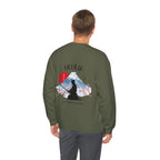 Man wearing green sweater with a mountain, samurai, and blossom tree design on the back saying 'un-influenceable' against a white background