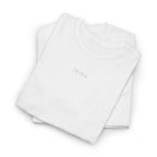 Folded white shirt with an IKIRU logo on a white background