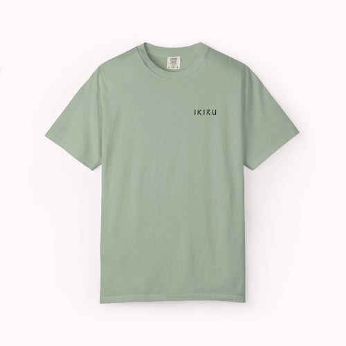 Green t-shirt with a small logo on a white background