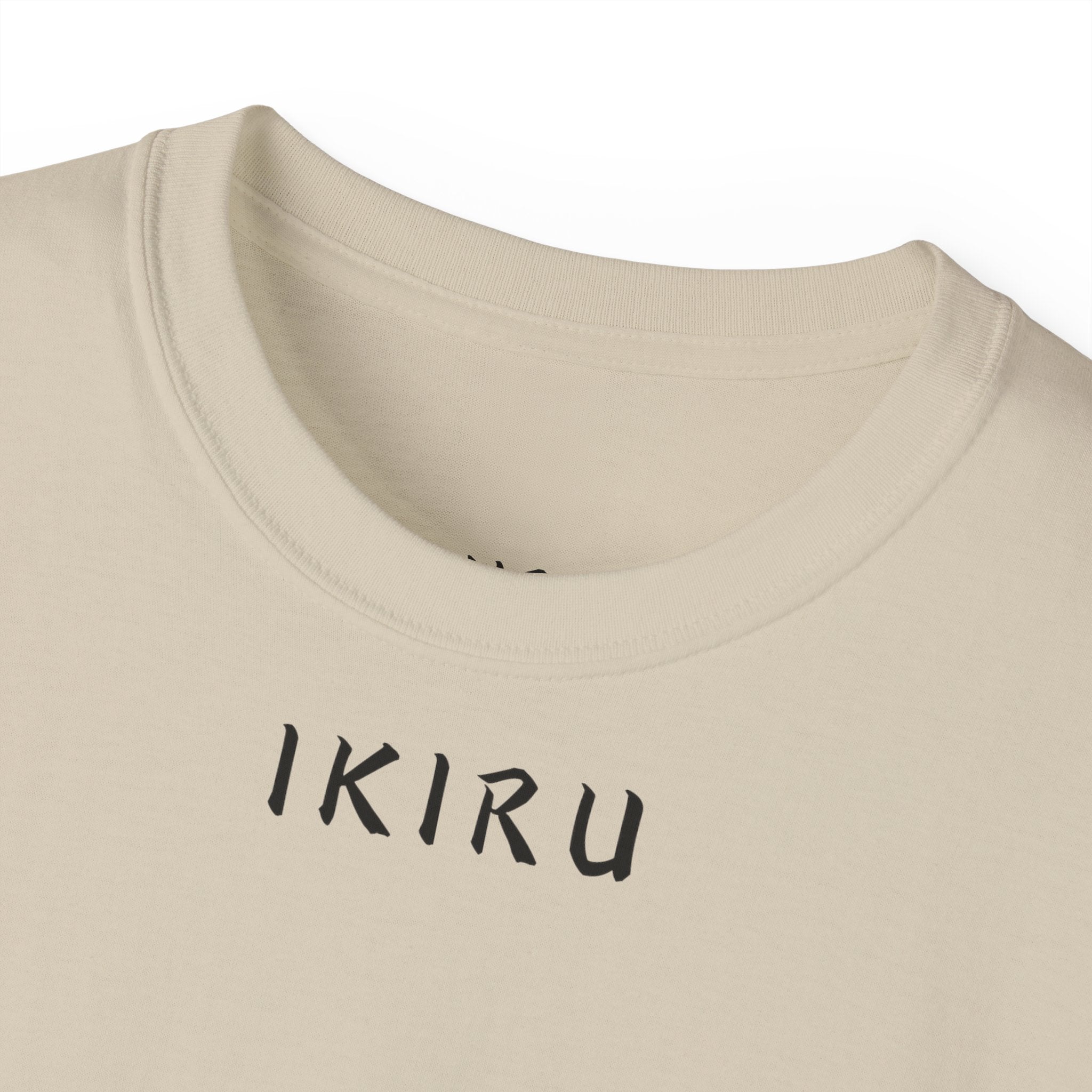 Beige shirt with IKIRU logo close-up on a white background