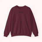 Maroon sweater with a small ikiru logo on the front
