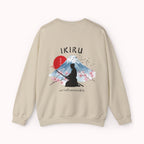 Beige sweater with a mountain, samurai, and blossom tree design on the back saying 'un-influenceable' against a white background