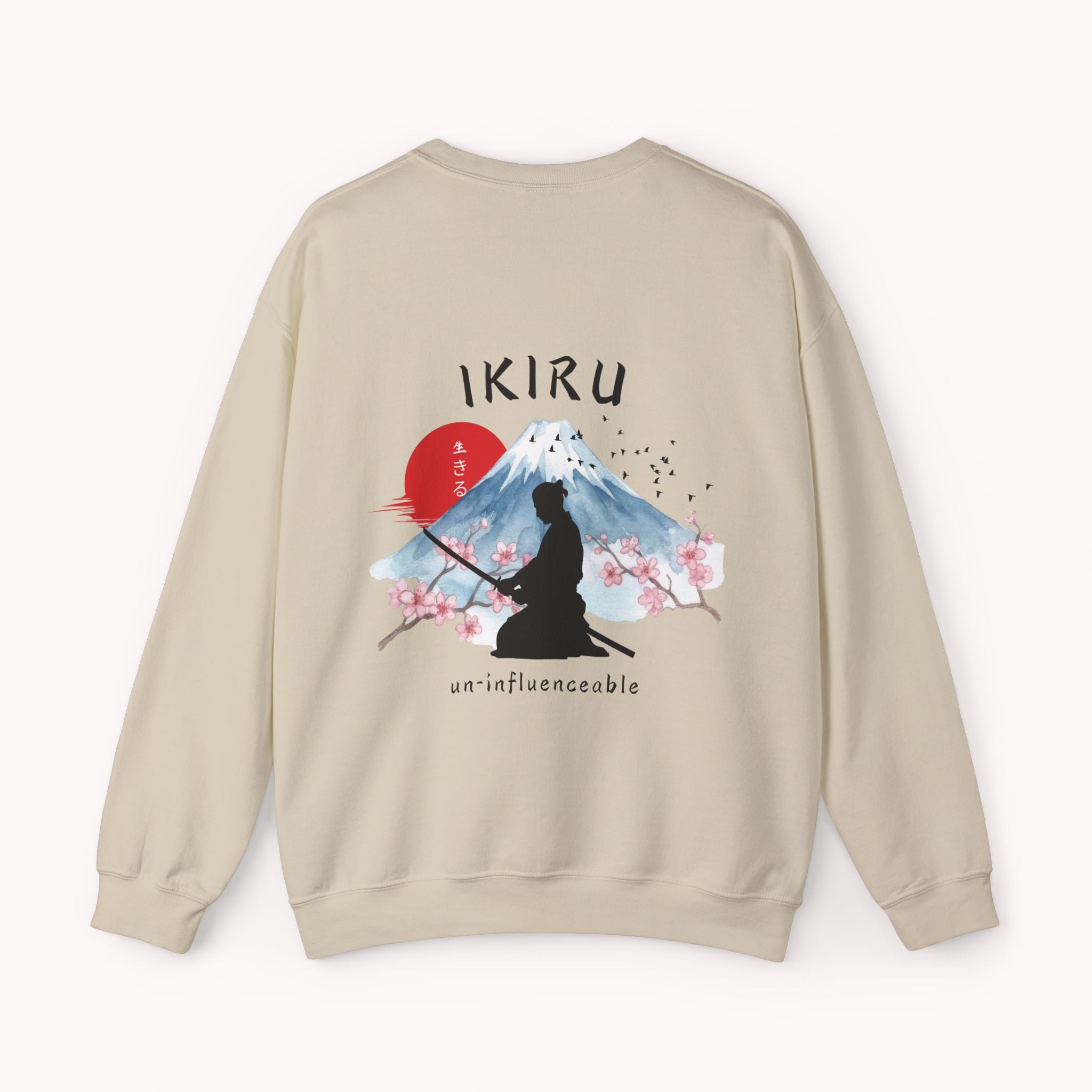 Beige sweater with a mountain, samurai, and blossom tree design on the back saying 'un-influenceable' against a white background
