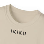 Beige t-shirt with 'IKIRU' printed on it against a white background