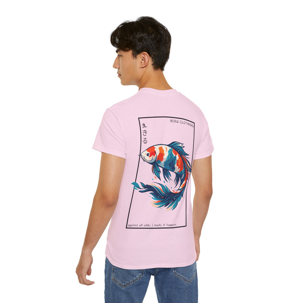 Person wearing a pink t-shirt with a colorful koi fish design and 'IKIRU CLOTHING' branding on a white background
