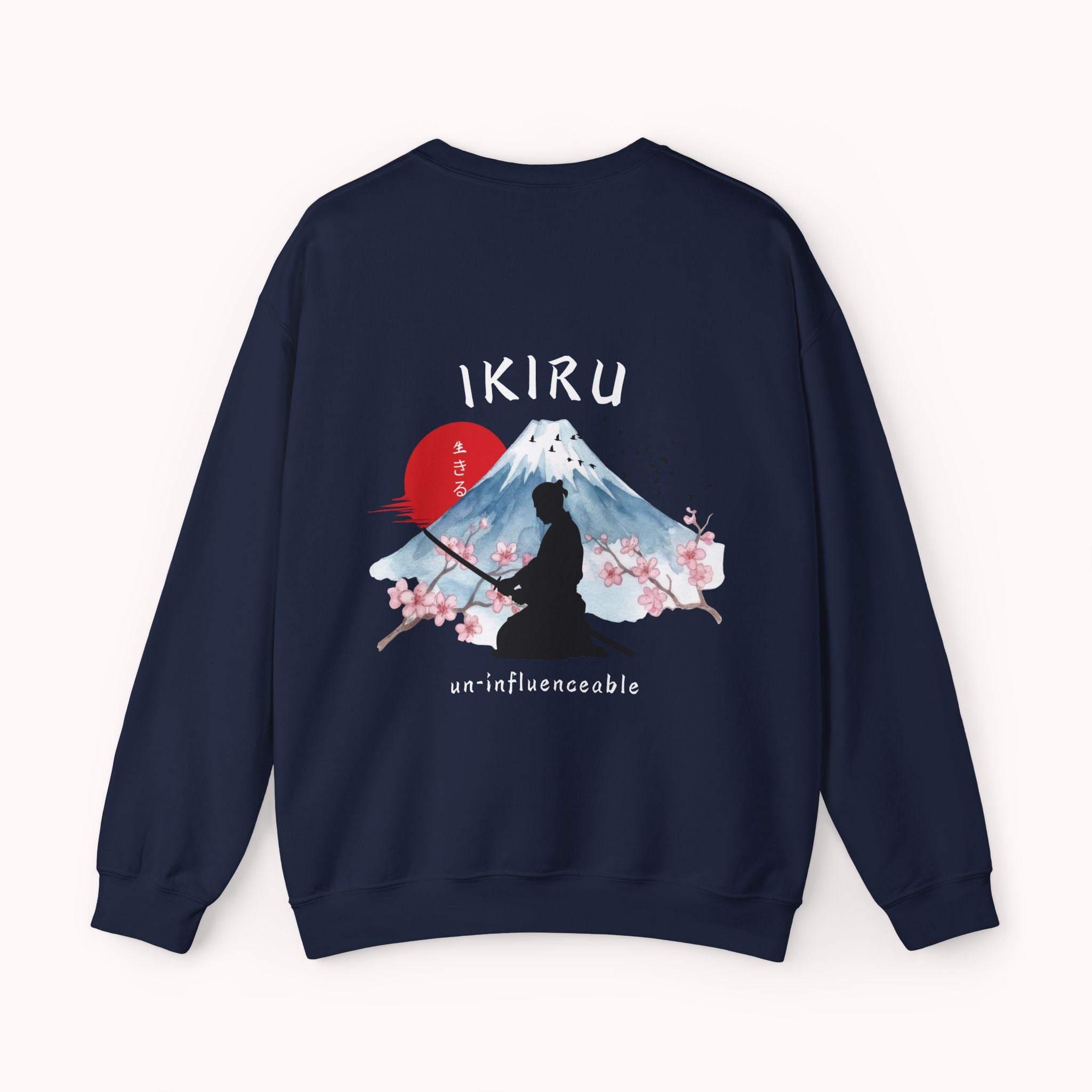Navy sweater with a mountain, samurai, and blossom tree design on the back saying 'un-influenceable' against a white background