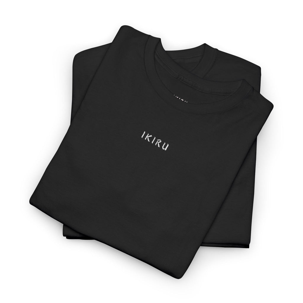 Folded black t-shirt with an IKIRU logo on a white background