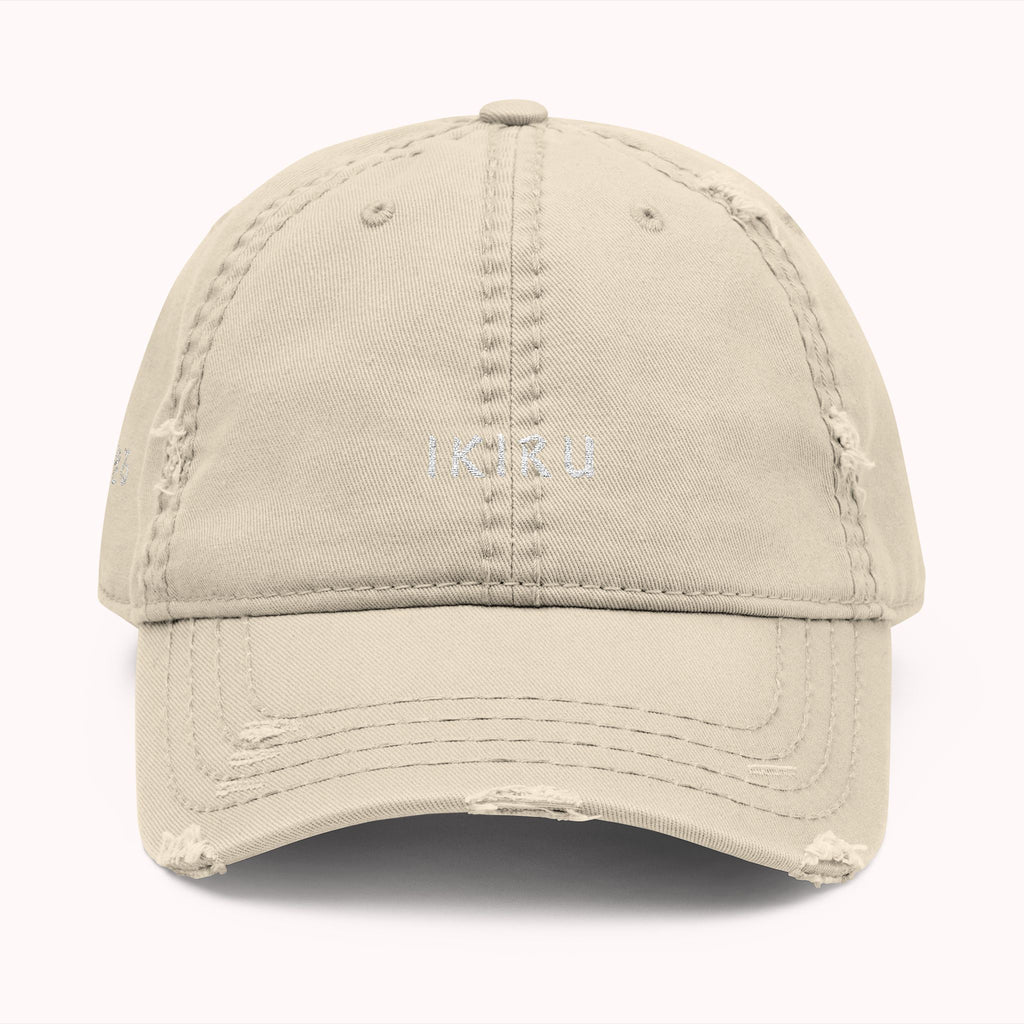 Beige cap with a white logo on a white background