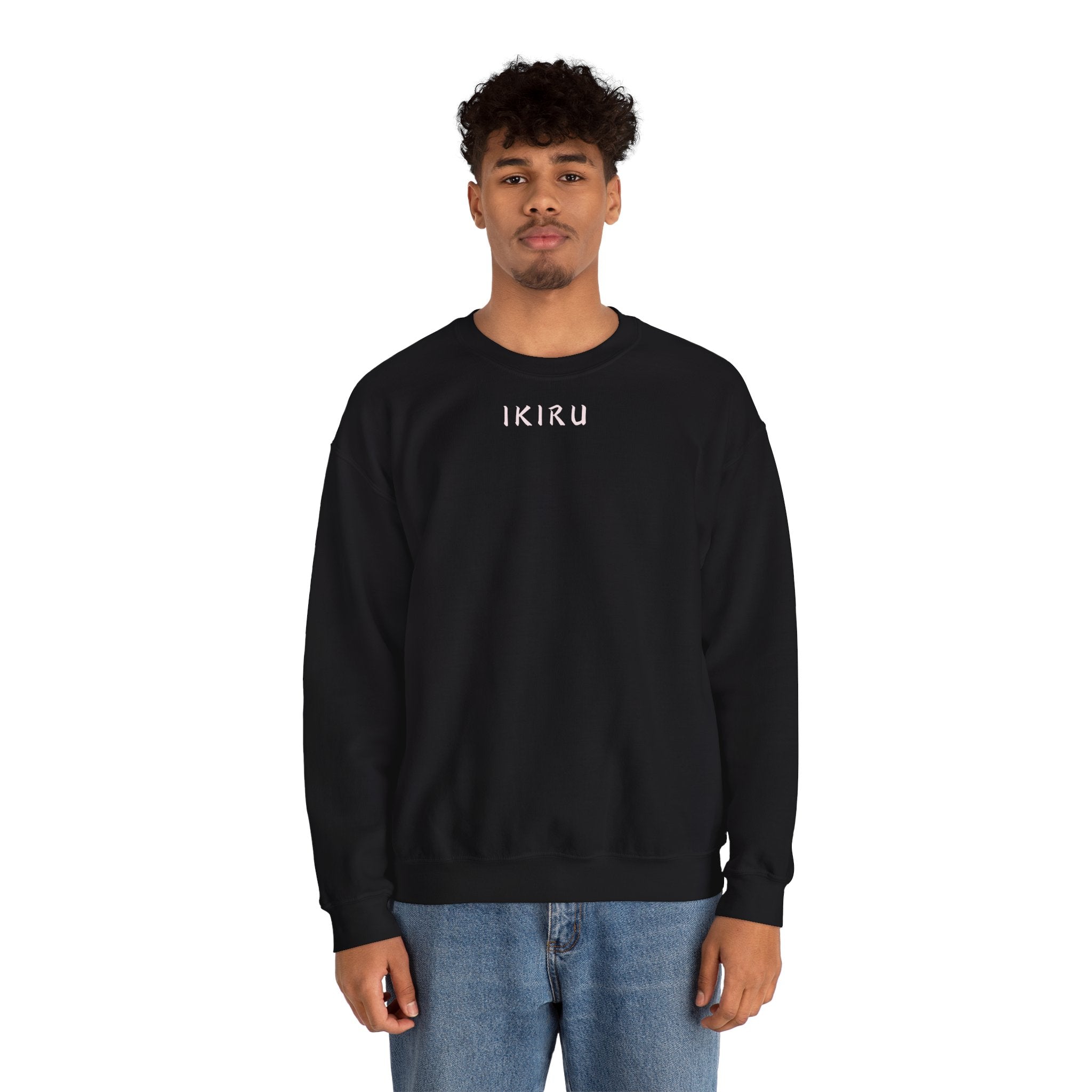 Man wearing black sweater with a small ikiru logo on a white background