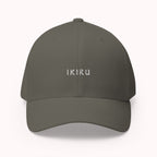 Dark gray cap with an IKIRU design on a white background