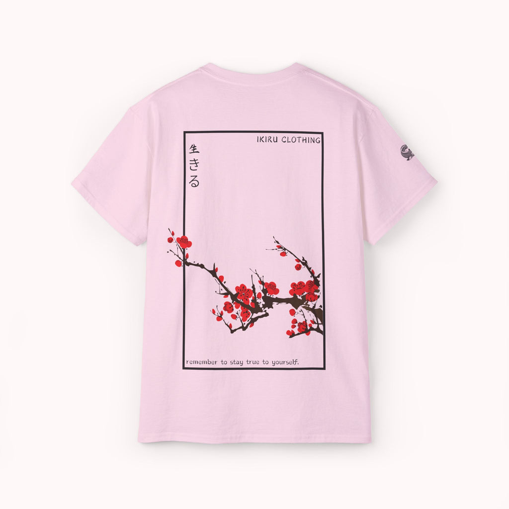 Pink t-shirt with Japanese cherry blossom design from 'IKIRU CLOTHING' on a white background