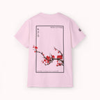 Pink t-shirt with Japanese cherry blossom design from 'IKIRU CLOTHING' on a white background