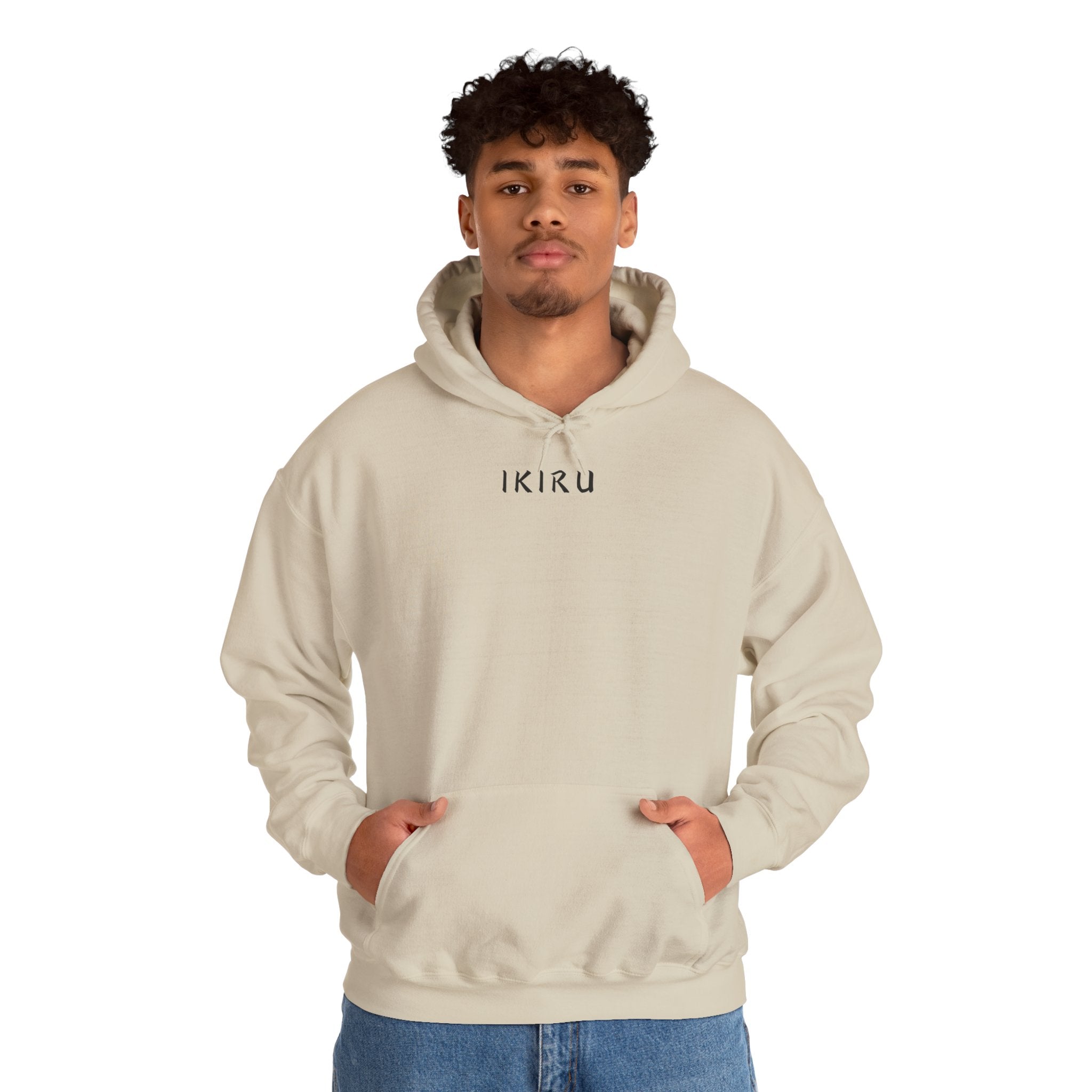 Beige hoodie with 'IKIRU' and mountain, samurai, and blossom tree design on the back saying 'un-influenceable' against a white background