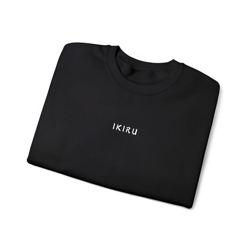 Folded Black sweatshirt with an IKIRU logo on a white background