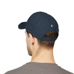 Navy blue cap worn by a person on a white background
