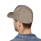 Beige baseball cap worn by a person on a white background