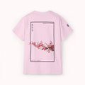 Pink t-shirt with cherry blossom design and IKIRU logo on a white background