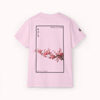 Pink t-shirt with cherry blossom design and IKIRU logo on a white background