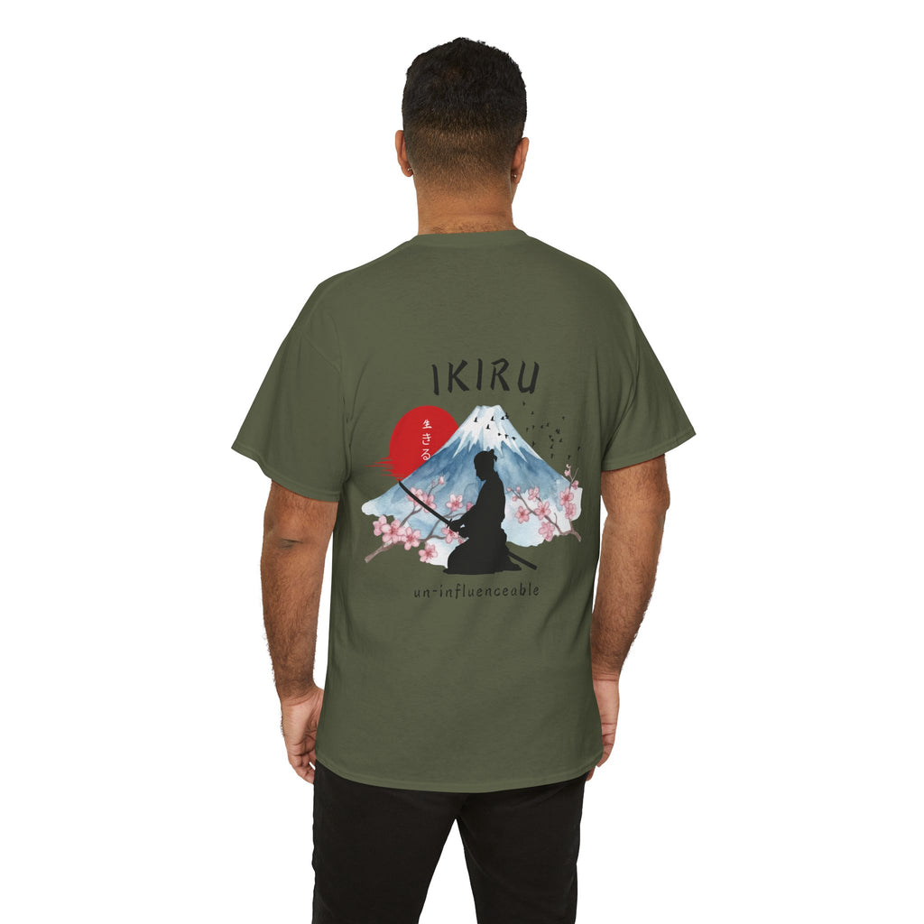 Person wearing green t-shirt with Japanese mountain, samurai, blossom and IKIRU on the back on a white background