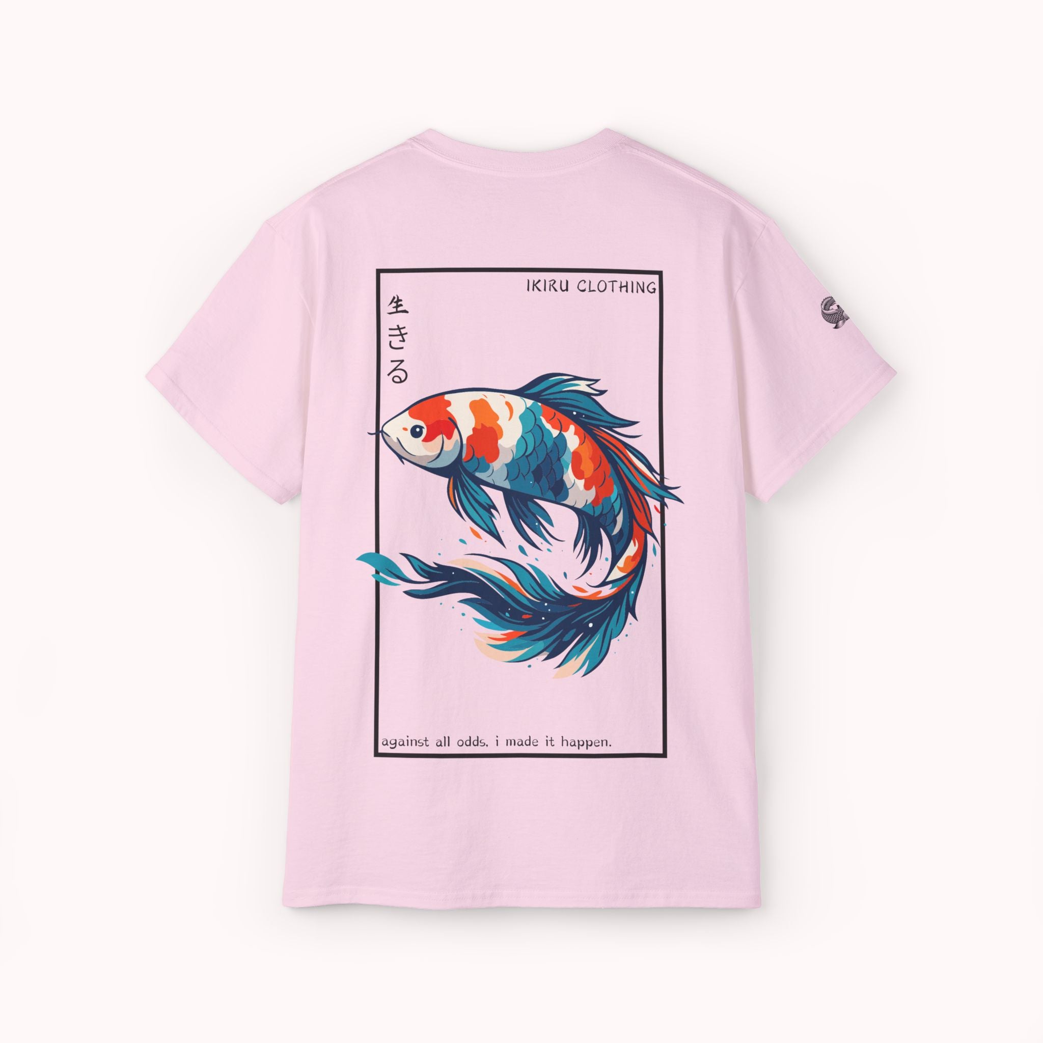 Pink t-shirt with a colorful koi fish design and 'IKIRU CLOTHING' branding on a white background