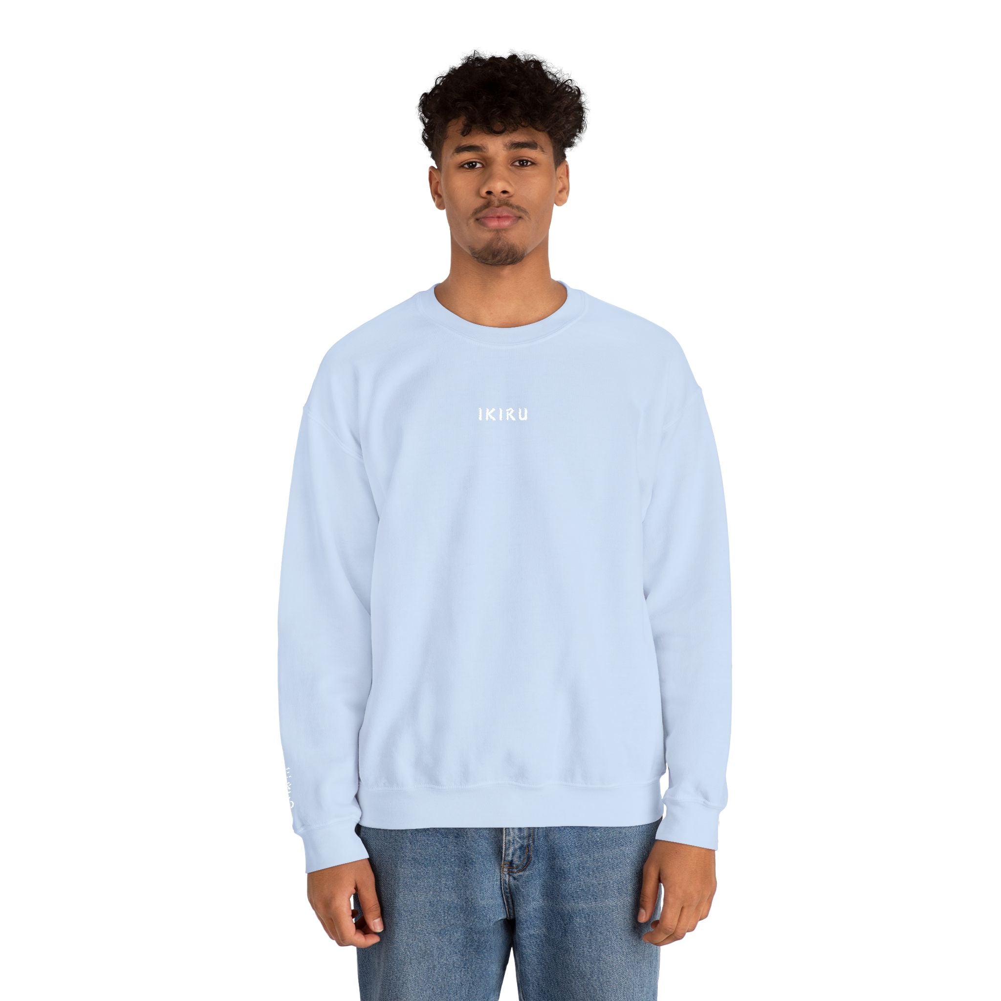 Person wearing a light blue sweatshirt with IKIRU logo on a white background