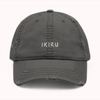 Gray cap with 'IKIRU' branding on a white background